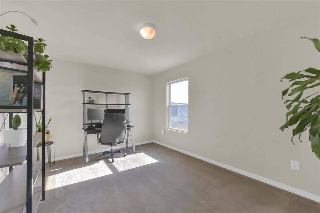 The fourth bedroom offers a bright and welcoming atmosphere with good natural light streaming in through its window