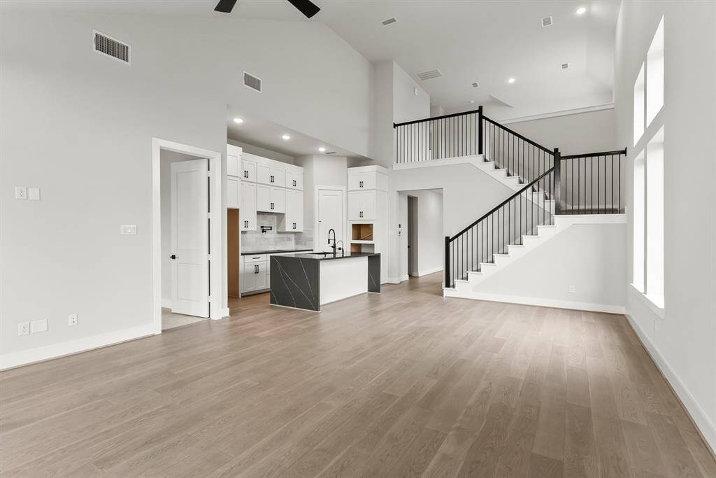 Stacked cabinets, potfiller, built in appliances, porcelain countertoops, and stair parts, OH MY!!!!