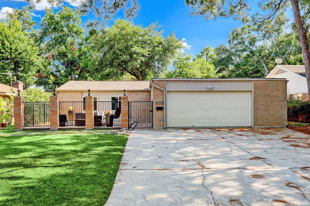 Extra wide double driveway before you enter into this uniquely large front patio