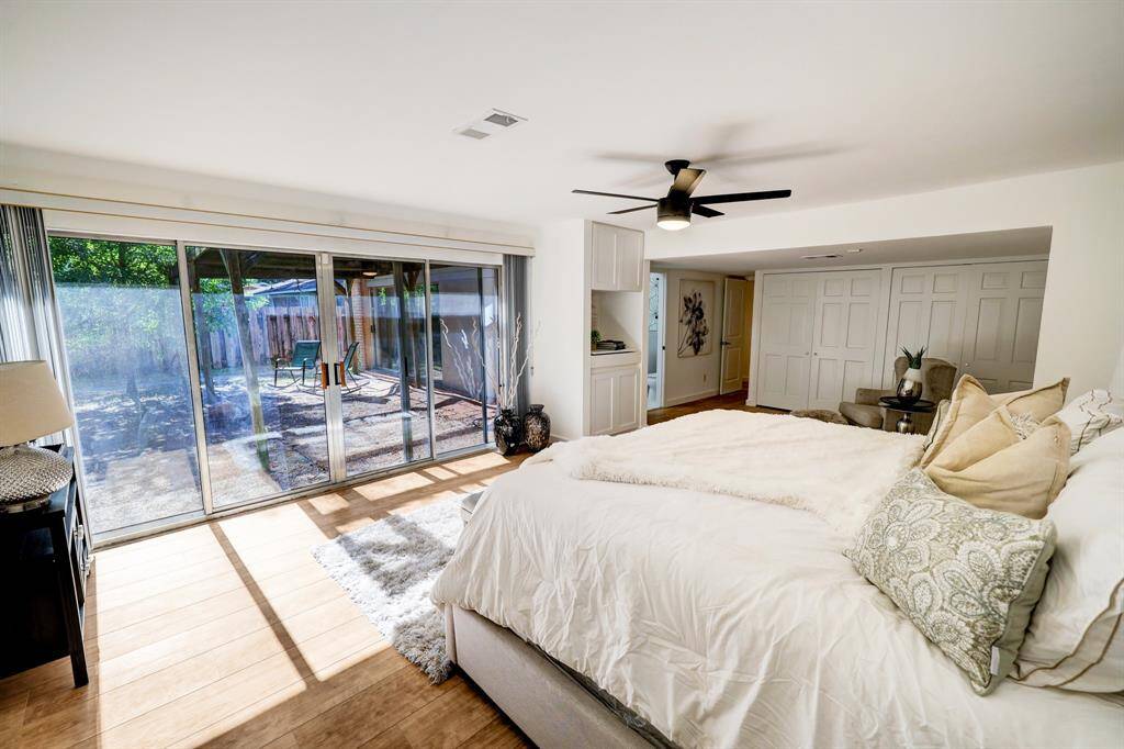 Sliding glass doors galore with beautiful view of the back yard