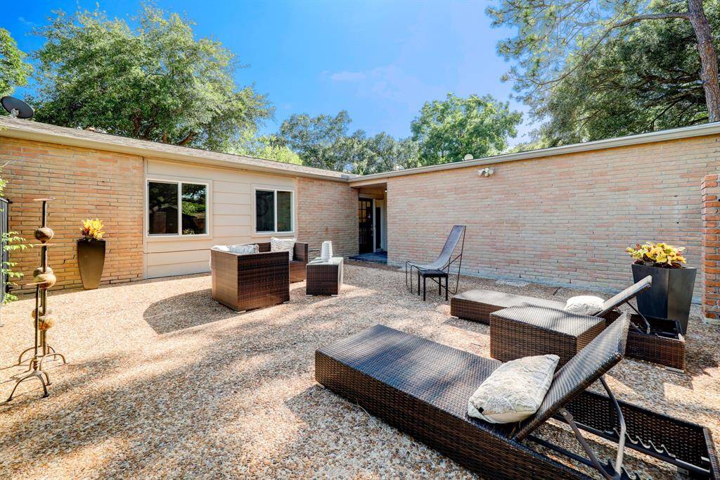 Gated front patio is large and welcoming