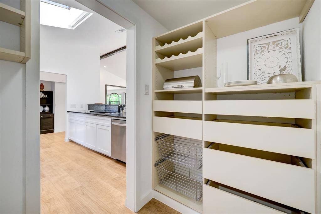Custom pantry with many drawers and pull outs including wine rack