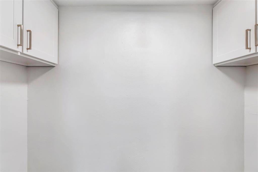 Efficient laundry room with convenient washer and dryer hookups.