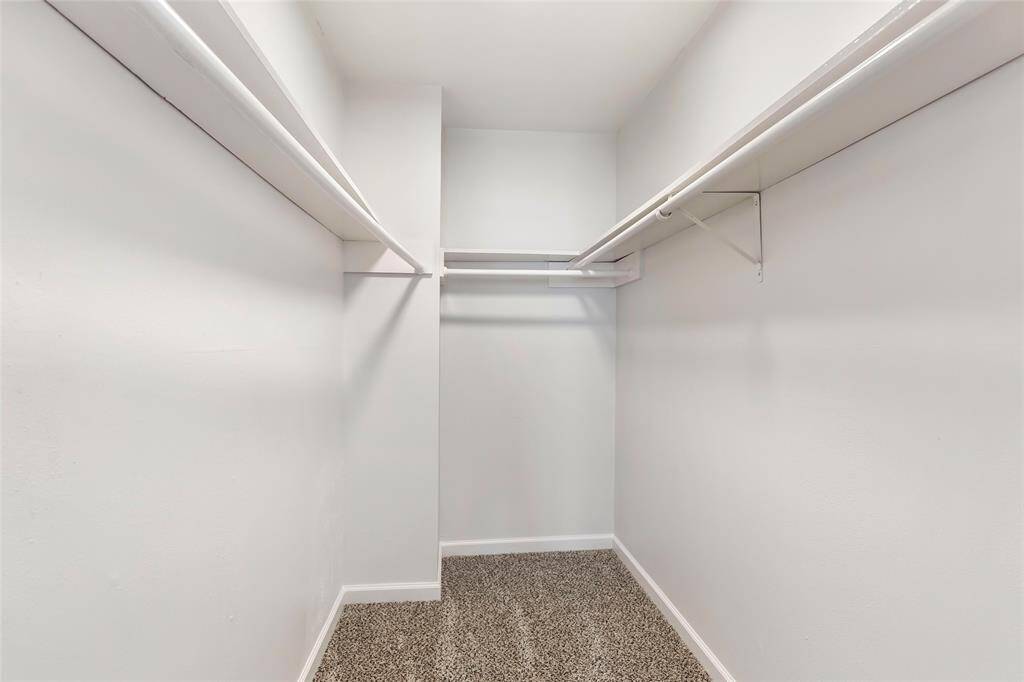 Spacious walk-in closet in the primary bedroom.