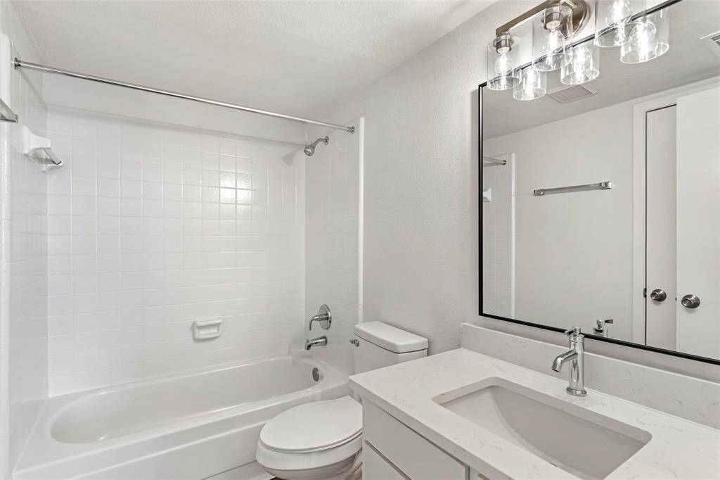 Elegant ensuite in the secondary bedroom offers modern comfort and style.
