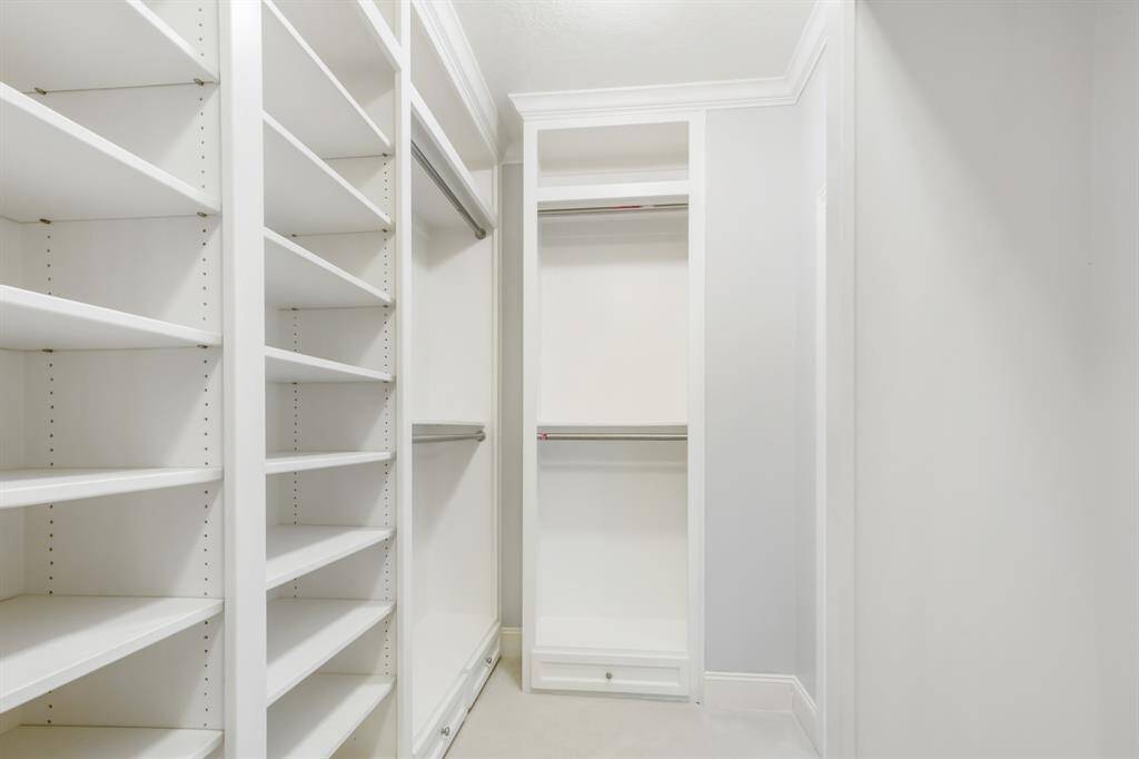 Another view of the luxurious primary bedroom custom closer