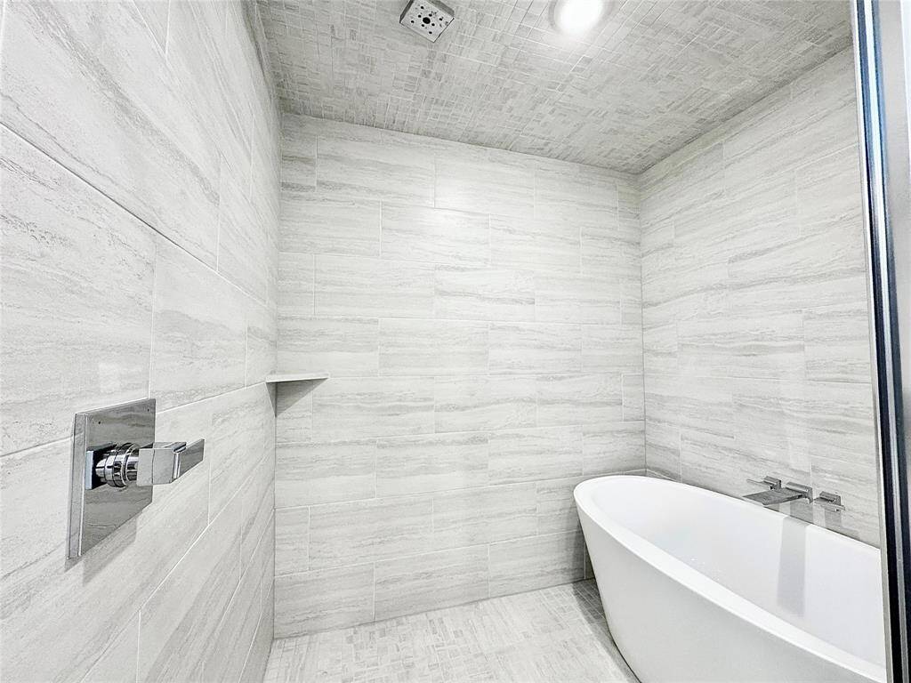 Enclosed shower with freestanding bathtub