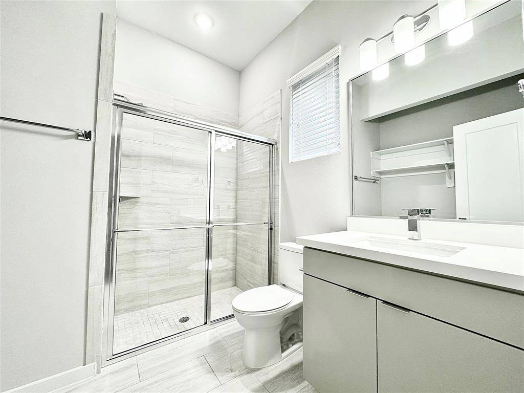 First floor - bathroom with standup shower and closet