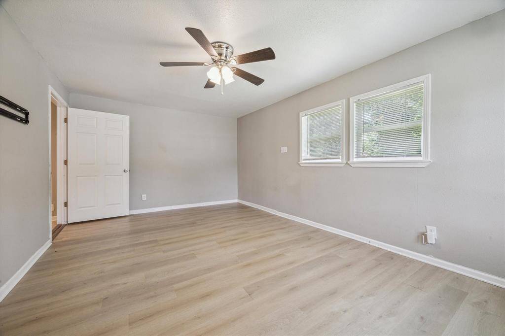 Primary Bedroom overlooking the backyard