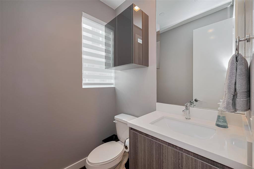 Half Bath with floating vanity and motion sensing lighting below