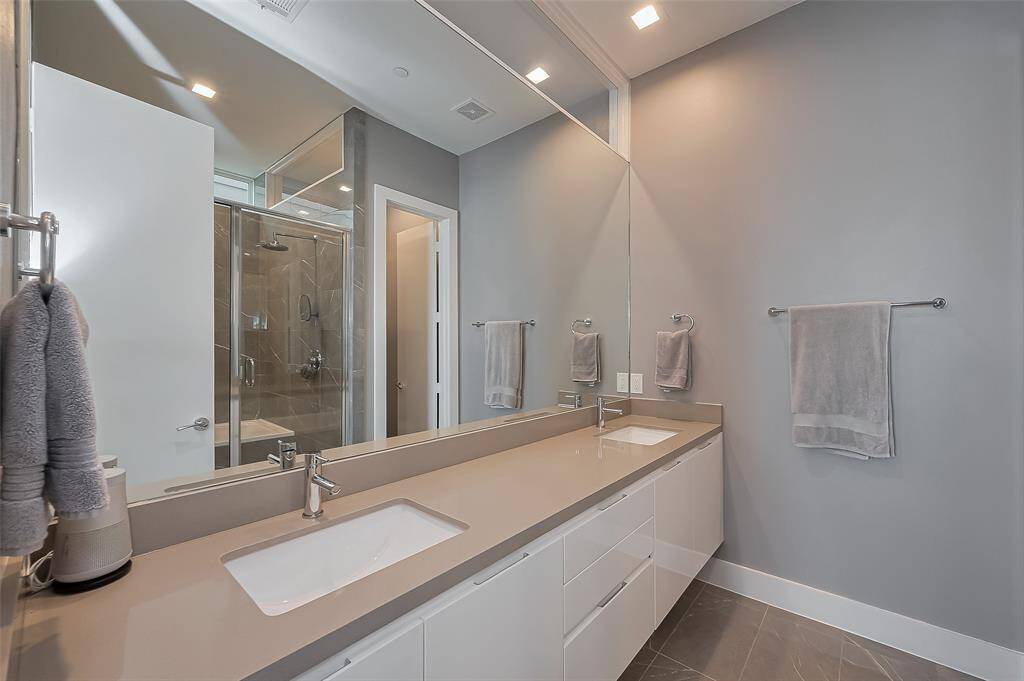 Primary Bathroom dual floating vanity with motion sensing lighting below
