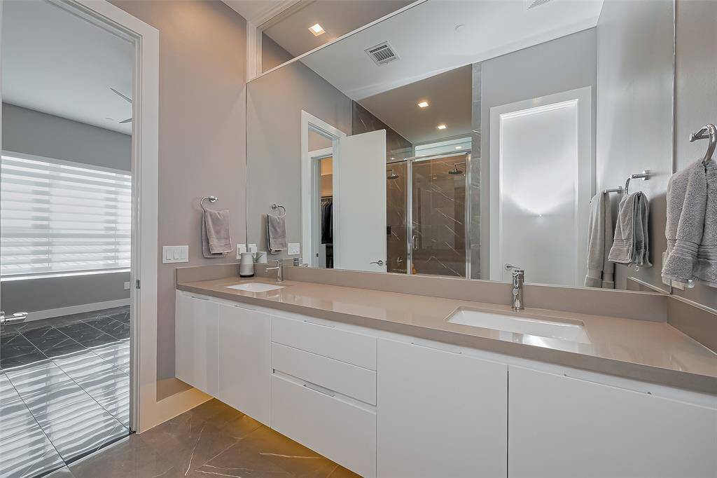 Another view of the primary bathroom floating vanity and the lighting below