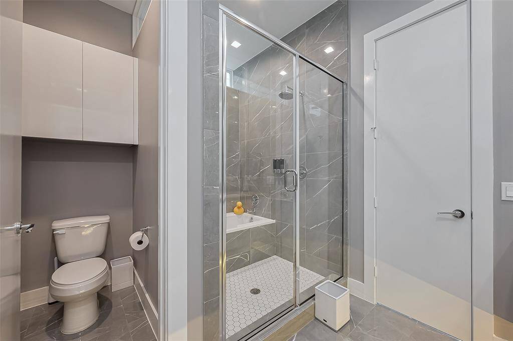 Another view of the primary bathroom floating vanity and the lighting below