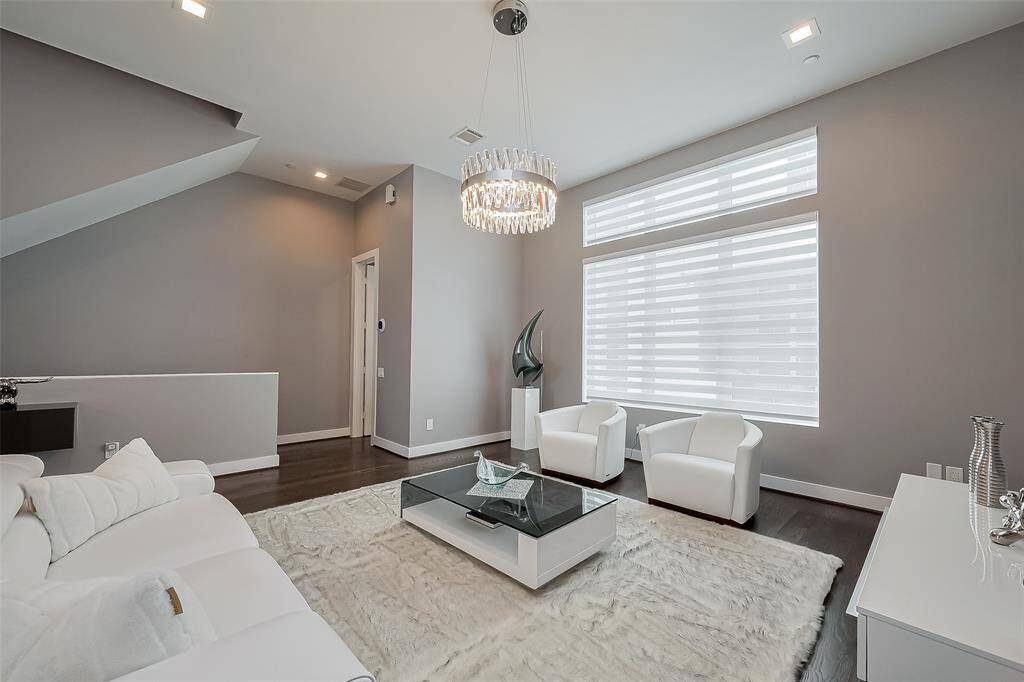 Beautiful matching crystal chandeliers in main living and dining area on floor 2