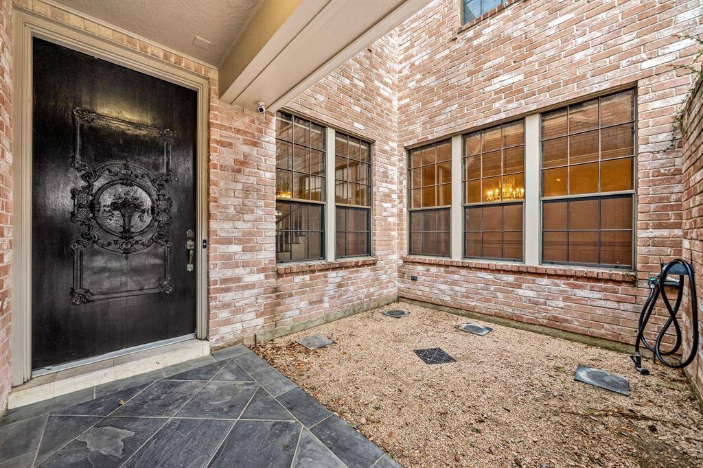 Gated courtyard entry.