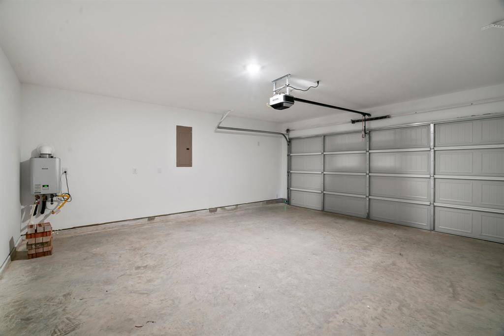 Two car garage with installed door opener.