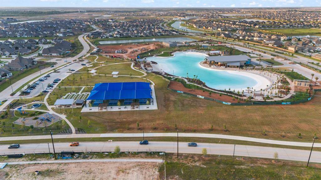 Aerial view of lagoon and pickel ball courts.