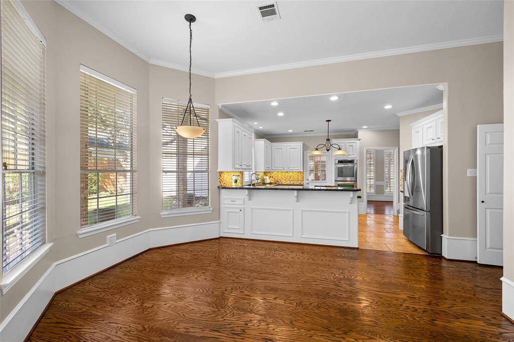 Breakfast room with pendant light serving as the centerpiece for the beautiful lighting in this space.