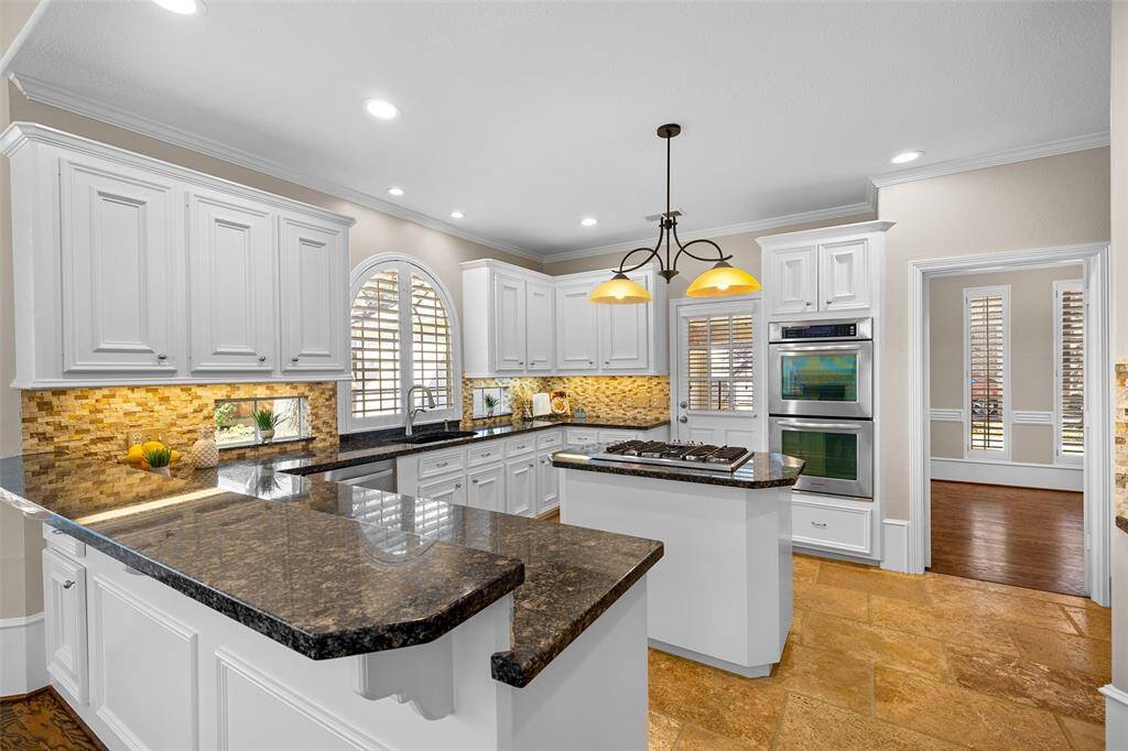 Beautifully updated kitchen with stainless appliances including a double oven with one being a convection oven.
