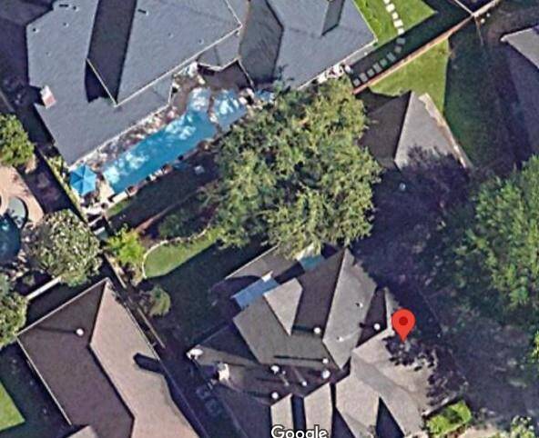 Backyard has room for a pool as can be seen with the neighbor's home behind the property with a smaller yard.