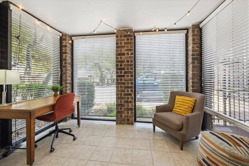 Sun room is a perfect home office or reading nook
