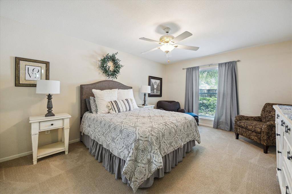 Spacious primary bedroom is light and bright with bath en-suite