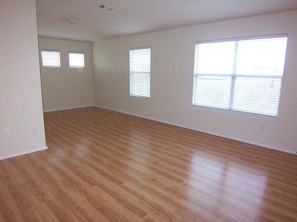 Gameroom with plank hardwood flooring.