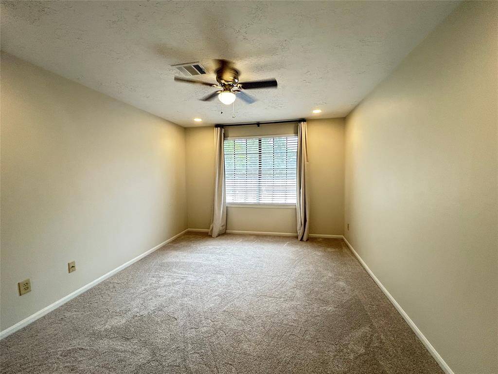 Primary bedroom with custom curtains/rods