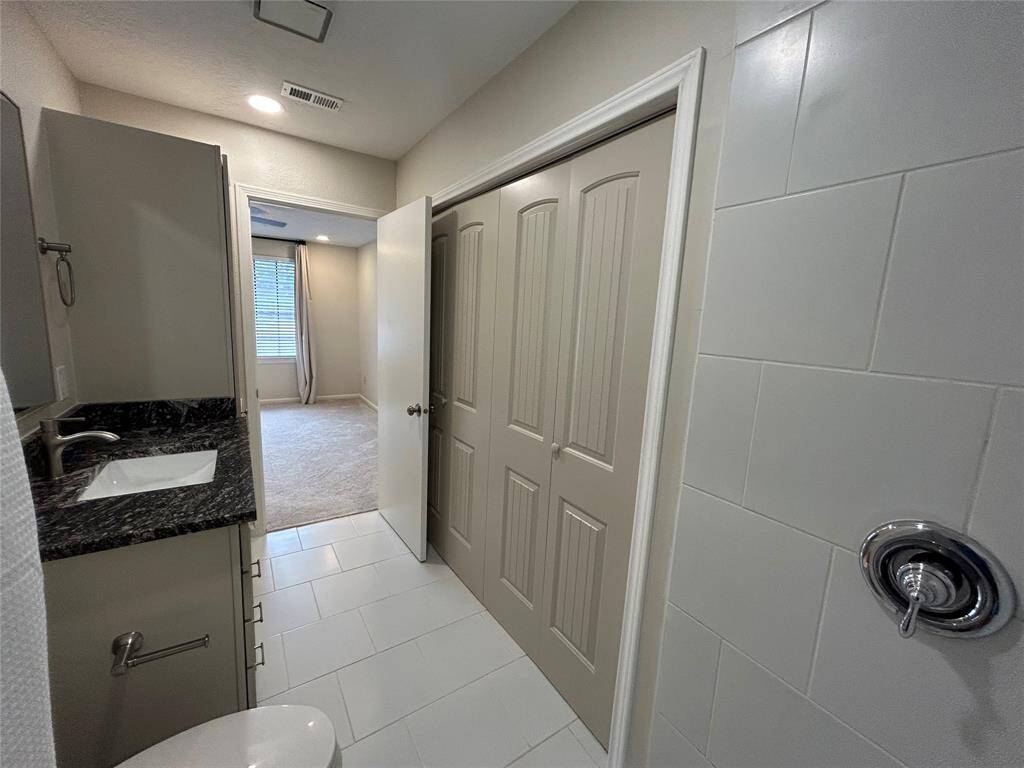 primary bath looking into bedroom and closet