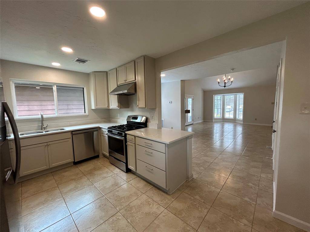 View from Kitchen towards dining and family room