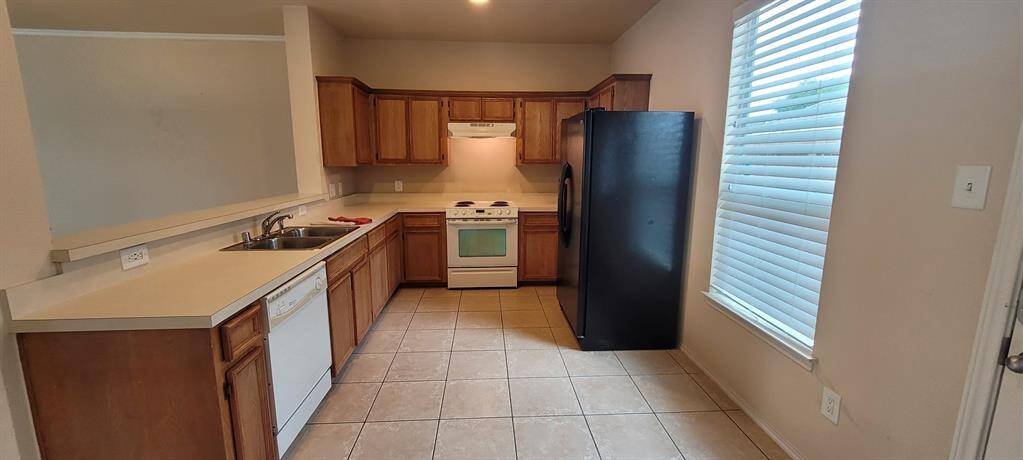 Kitchen with refrigerator