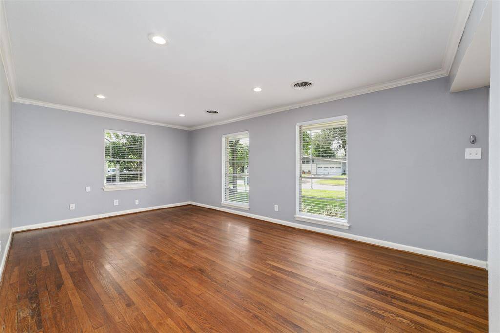 Large windows and recessed lights inliving area