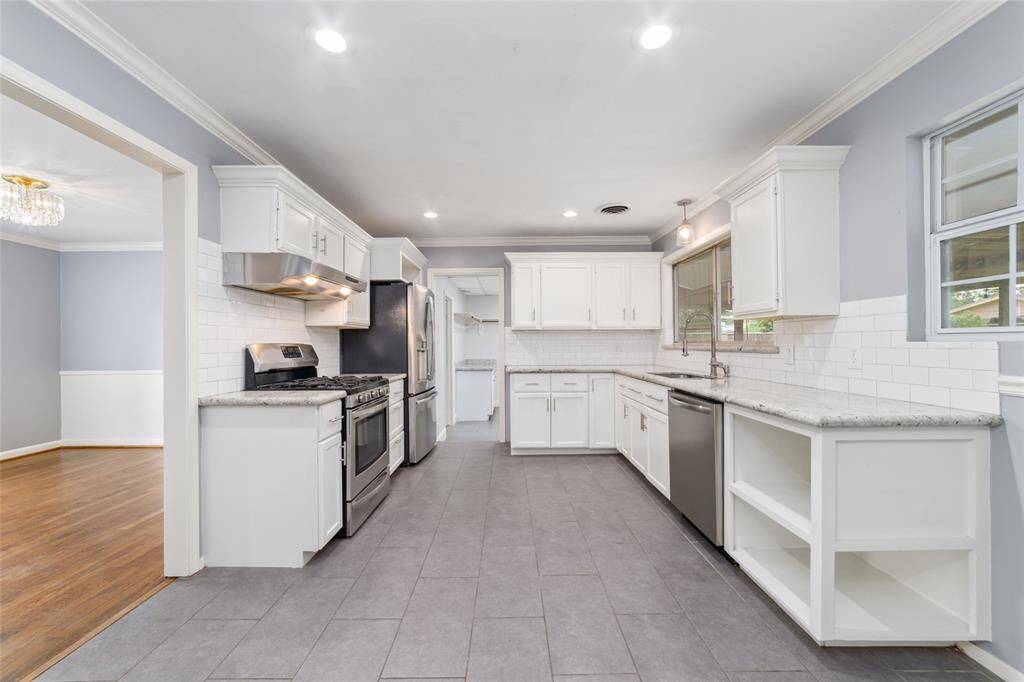 Spacious kitchen featuring granite counter tops and plenty of cabinet space