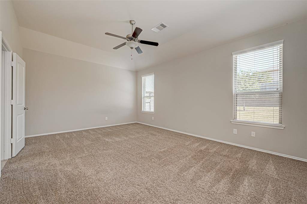 Retreat to the spacious primary suite with its own en-suite bathroom, providing a private oasis for relaxation.