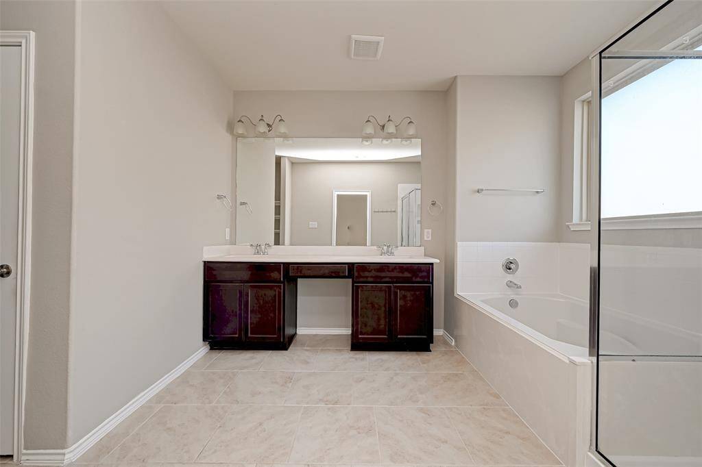 Welcome to your very own retreat within your home! This exquisite primary bathroom is a true masterpiece, offering a perfect blend of elegance, comfort, and functionality.