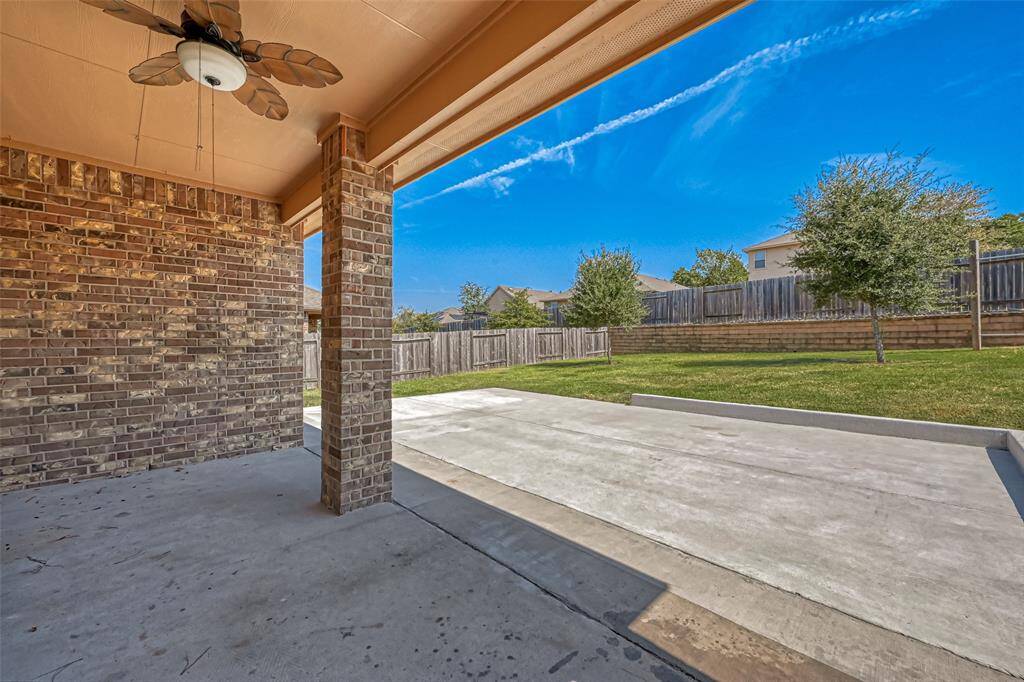 Step outside and be greeted by an outdoor haven that's perfect for gatherings or quiet contemplation. The lush landscaping, shaded pergola, and paved pathways add to the ambiance, creating a picturesque escape within your own property.