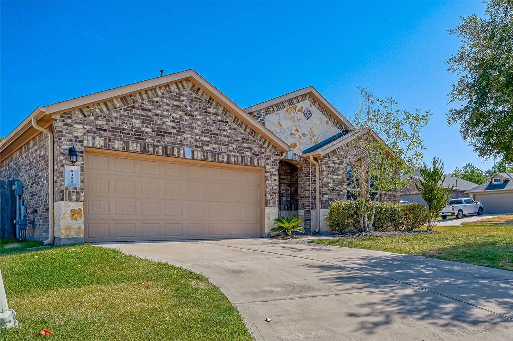 The attached garage provides ample space for parking and storage, ensuring convenience and organization.