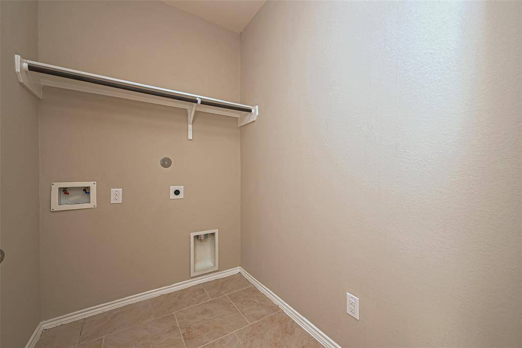 This thoughtfully designed small laundry area combines practicality with style, offering you the perfect space to tackle your laundry tasks while maximizing the use of available square footage.