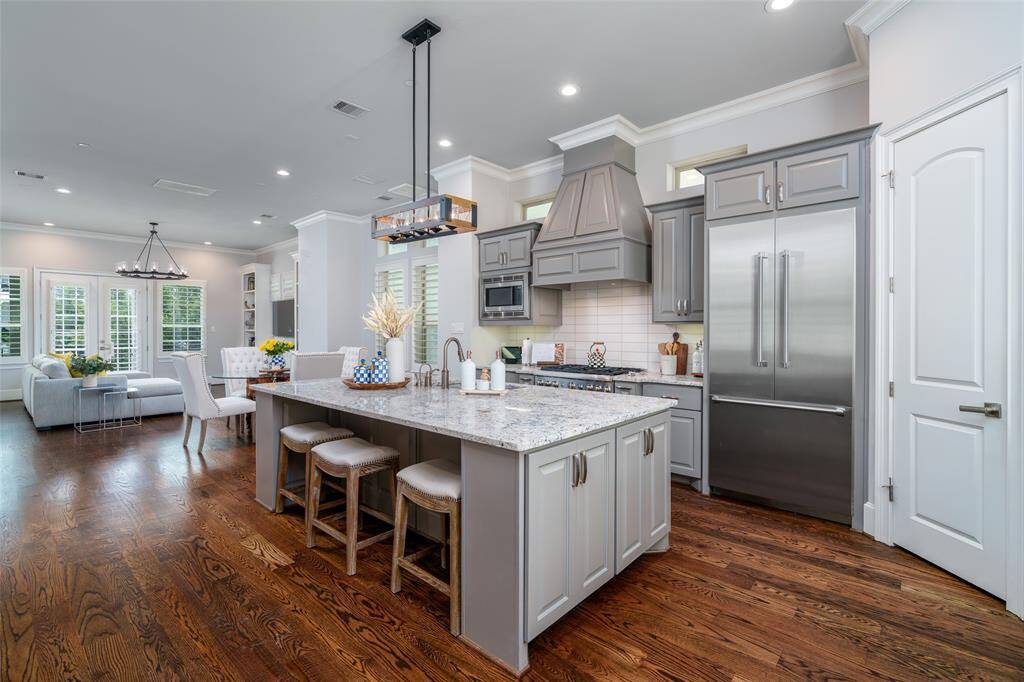 This stunning kitchen seamlessly connects to the dining and living areas, perfect for everyday living and entertaining.