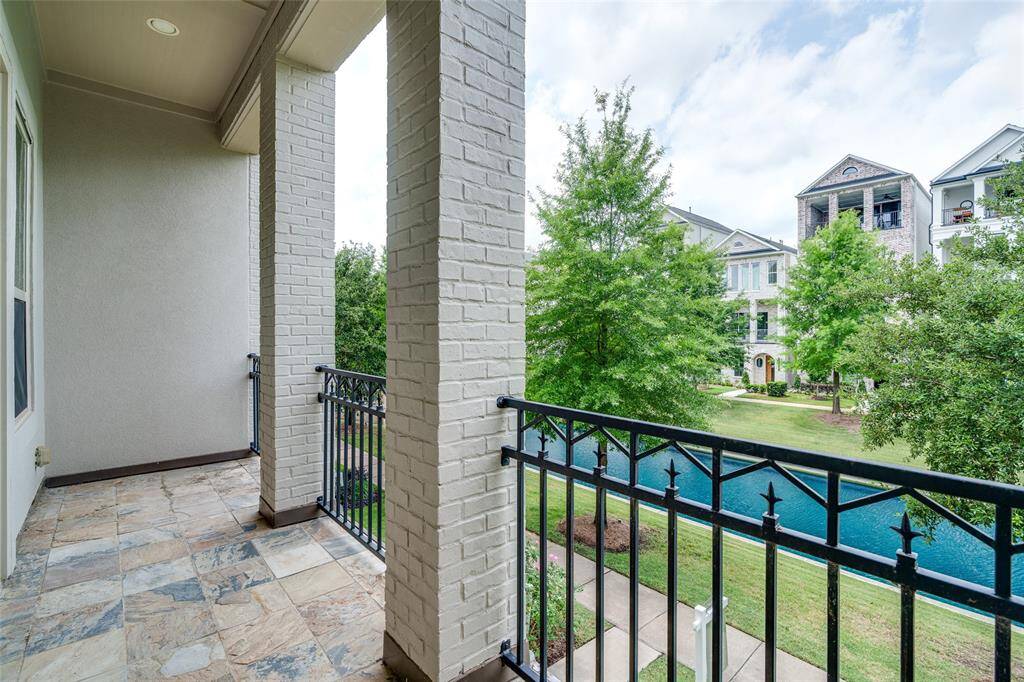 Enjoy stunning waterfront views from the elegant balcony off the living room.