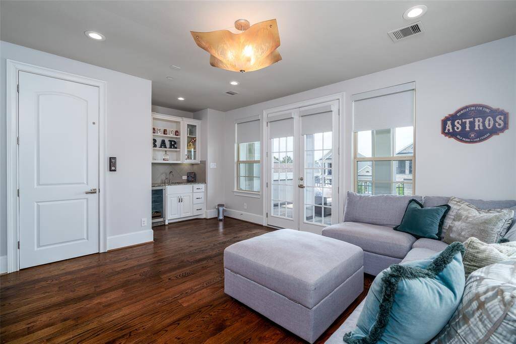 The game room offers direct elevator access and features a wet bar with a beverage fridge, perfect for entertaining.