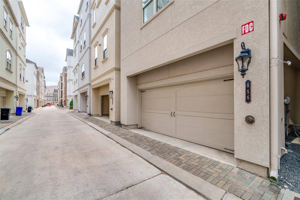 Spacious two-car garage with convenient alley access.