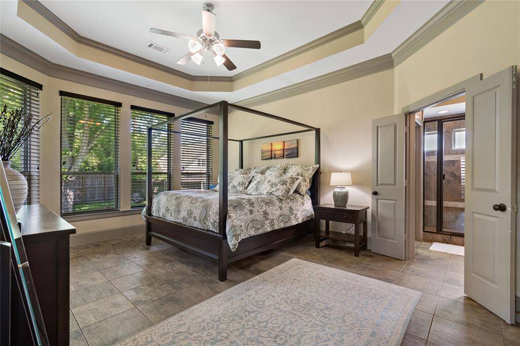 The owner's elegant retreat! Large primary bedroom with tray ceiling