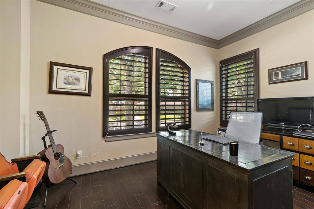 To the left of the front door is the private office