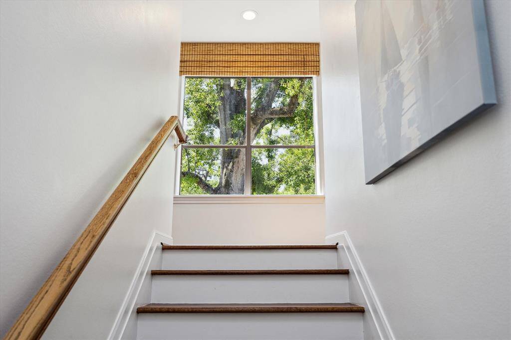 A second staircase leads to guest suites and an additional upstairs study, combining elegance and efficiency. Custom millwork and discreet storage complete the design. A graceful transition between levels of the home.