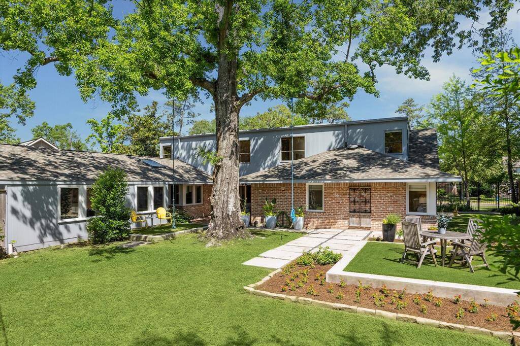 The sprawling backyard offers natural grass, artificial turf, and defined sitting areas perfect for lounging or play. With ample room to add a pool, this outdoor space is ready to become your personal retreat. Designed for year-round enjoyment and effortless entertaining.
