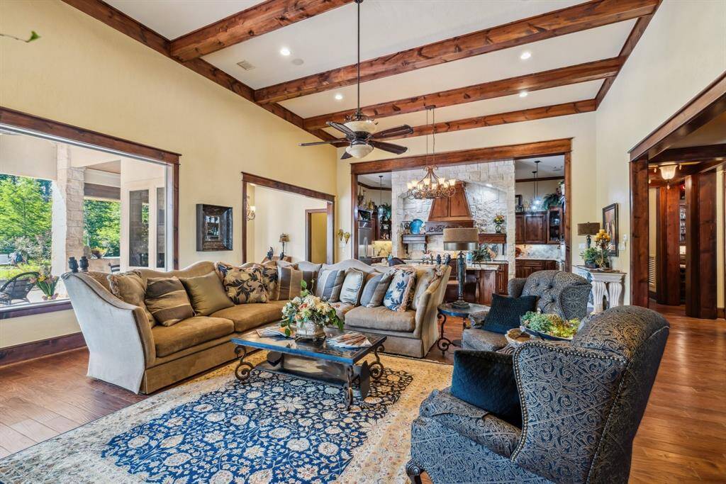 The space is well-lit with upper cam lighting and under-cabinet lighting, creating a cozy and inviting atmosphere. The Chef in the family will absolutely this island kitchen.