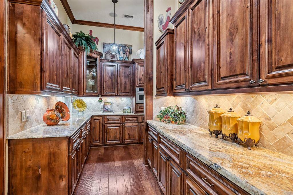 This house has so many high end amenities. Gorgeous tile ceiling and stunning light fixture!