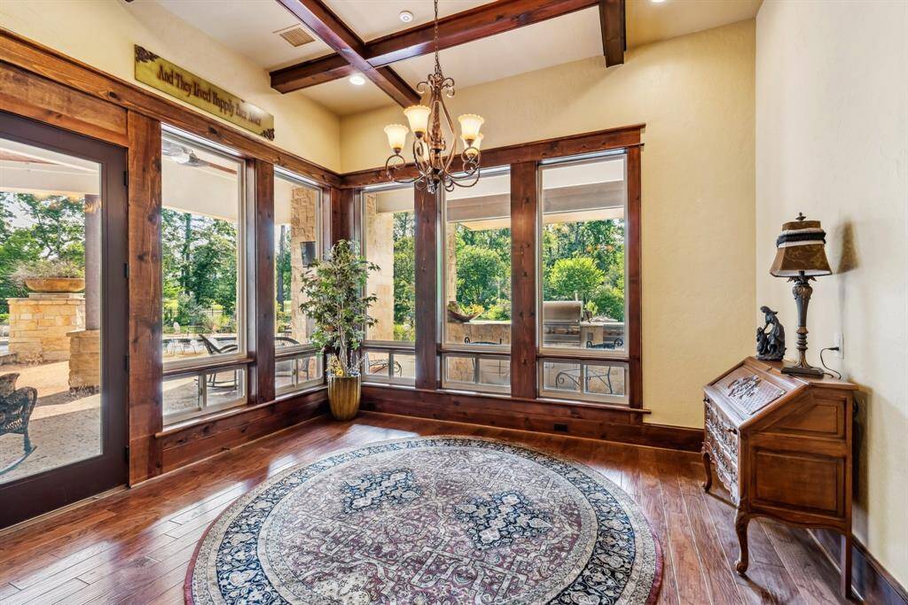 This spacious primary bathroom features elegant double sinks with granite countertops, a luxurious soaking tub, and a vanity area for the Ladies. High ceilings, soft lighting, and a soothing color palette create a relaxing atmosphere.  This is the "hers" side.