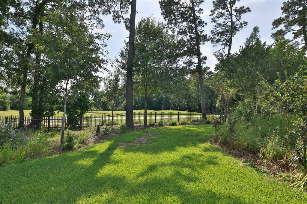 Enjoy a two-car garage with a convenient pathway leading to a spacious mancave and half bath.